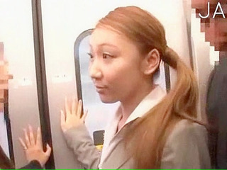 Japanese office worker gets horny with naughty nipple fondling on a Tokyo train.