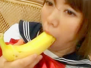 Busty Nippon schoolgirl drills her pink wetness with a banana for fucky fun